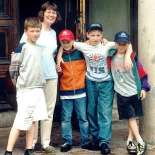 Birgitta Stålhammar, their National Coordinator, Sweden, with orphans